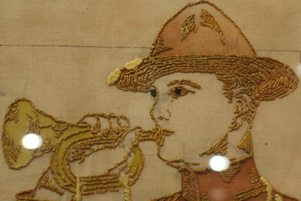 United States Army recruitment embroidered textile circa 1910, depicting a soldier bugler, his - Image 2 of 2