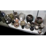 (lot of 25) Group of pottery vessels, mostly of Japanese, including jars, bowls and cups, largest: