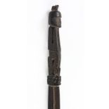 Papua New Guinea Trobriand Island lime spatula figure, Massim People, depicting a seated figure to