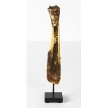 Papua New Guinea carved bone spatula with a strong and artful head/face atop, Melanesia and probably