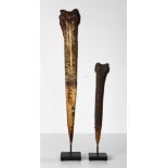 (lot of 2) Papua New Guinea bone daggers with much incised carving, probably cassowary bones, the