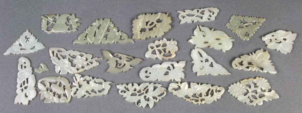 (lot of 20) Chinese small hardstone carvings, the celadon plaques reticulated with floral motifs and