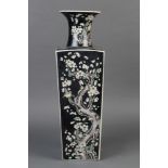 Chinese famille noir porcelain vase, with a trumpet neck above a tapering square sectioned body