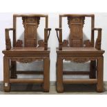 Pair of Chinese wooden armchairs, with a shaped back rail and a back splat painted with figures, the