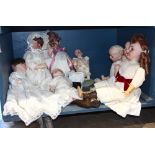 One of shelf mostly German bisque head dolls and baby dolls, makers include Simon and Halbig,