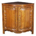 French Provincial Louis XV oak corner cabinet circa 1770, having two doors with carved and