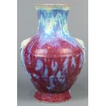 Chinese flambe glazed ceramic vase, with a trumpet neck above wide shoulders flanked by mock loose