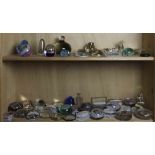 Two shelves of vintage retail and commemorative paperweights, including Shackamaxon Worsted Co.;