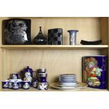 Two shelves of Rosenthal Bjorn Winoblad studio-line porcelains, including an extended
