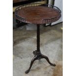 George III mahogany tilt-top tea table, possibly Irish, having a gallery top, above the standard