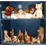Two shelves of stuffed animals and dolls, including 19th Century Steiff examples, wind up mechanical