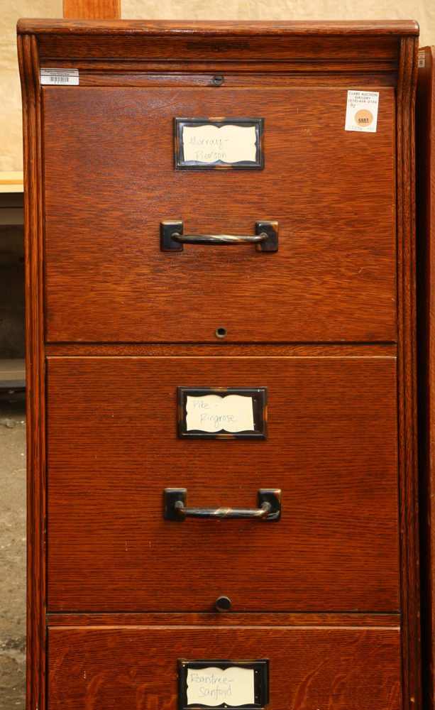 Four-drawer quarter sawn oak filing cabinet, 53"h x 16"w x 29"d