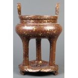Chinese gilt splash bronze tripod censer and stand, the vessel with inverted u-shaped handles on the