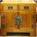 Chinese wooden coffer, fronted by a row of two drawers, above hinged double doors and a central