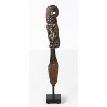 Papua New Guinea carved wood lime spatula with wavy and spiral designs, common to Massim people,