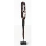 Papau New Guinea fine small lime spatula, carved with 29 round holes, two long slats and ribbed