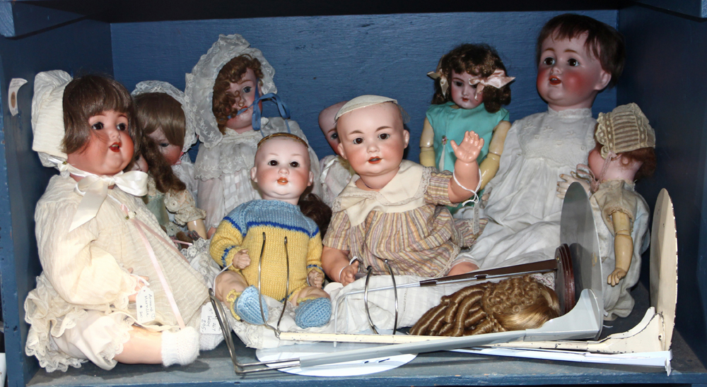 One shelf of mostly German bisque head dolls, makers include Kestner, Armand Marseille, and Max