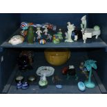 Two shelves of vintage porcelain and china table articles, consisting of salt and pepper shakers