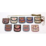 (lot of 9) Chinese embroidered wallets, each double flaps and a central slip pocket, six pink and