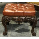 Georgian style tufted and carved oak ottoman, having a rectangular profile above the carved oak