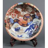 Japanese Imari deep bowl, interior with bamboo and flowers, goldfish in reserve, above blue horses