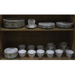 Two shelves with a partial Royal Doulton dinner service in the "Rondo" pattern, consisting of (12)