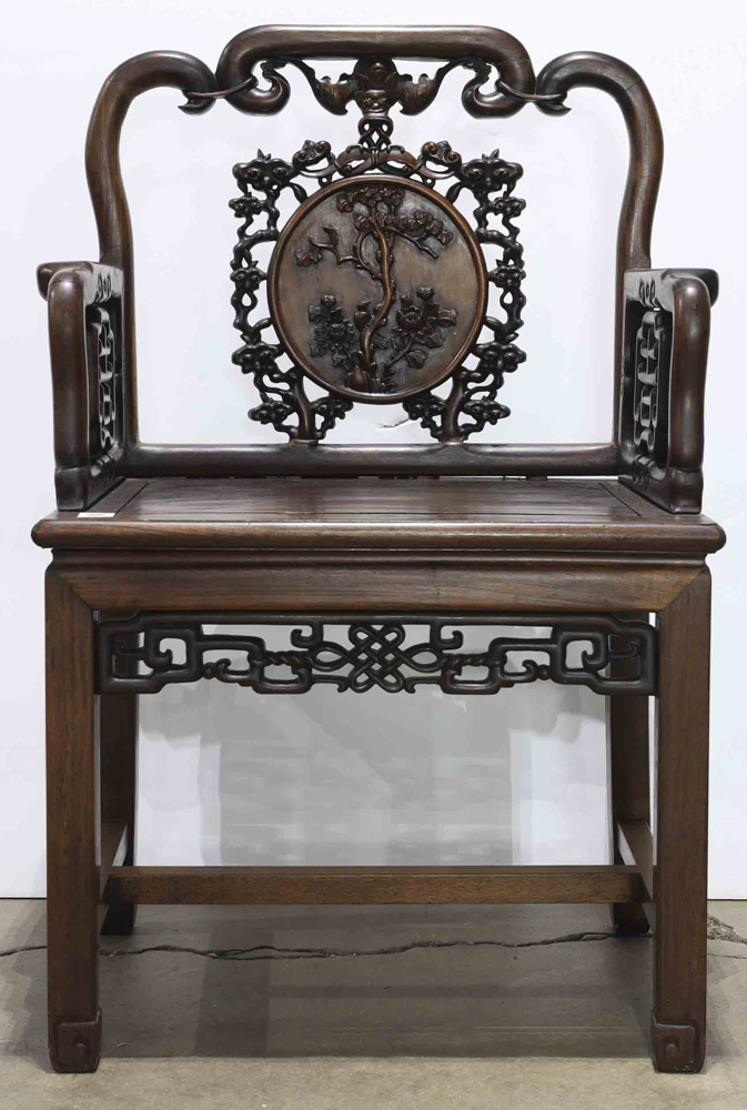 Chinese hardwood armchair, back with a bat suspending a roundel with flowers framed by pierced