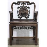 Chinese hardwood armchair, back with a bat suspending a roundel with flowers framed by pierced