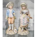 (lot of 2) German porcelain bisque figural group, each depicting a child in period attire, both