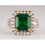 Emerald, diamond and 18k white gold ring