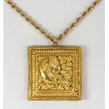Yellow gold pendant-necklace Featuring a square pendant, centering a mythical creature, in a pitch-