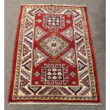 Pair of Uzbek Kazak carpets, 4'11" x 3'2" and 5'1" x 3'