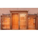 Edwardian display cabinet, of tripartie form with gallery top, above the four glass doors, 20 X 48 X