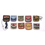 (lot of 9) Assortment of Chinese embroidered wallets: two green, one apricot color, and six of
