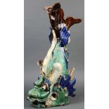 Chinese ceramic fish form roof ornament, with a green glazed body accented by blue fins, 22"h