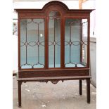 Chippendale style mahogany cabinet, having a rounded pediment top above mullioned style glass