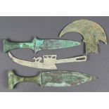 (lot of 4) Dongson bronze blades: consisting of an ax with scroll and sawtooth pattern; one blade