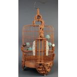 Chinese large bamboo and wooden bird cage, of cylindrical form accented by celestial beauties,