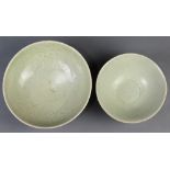 (lot of 2) Chinese Longquan type celadon glazed bowls, one molded with lotus petals to the exterior;