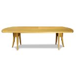 Modern custom designed dining table, by Ed Clay, executed in sycamore, having a shaped top with band