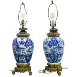 Pair of Chinoiserie decorated bronze mounted table lamps, having a porcelain cobalt decorated body