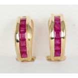 Pair of ruby and 14k yellow gold earrings