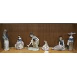 One shelf of Lladro figures, including sitting and kneeling girls with flowers, one with umbrella