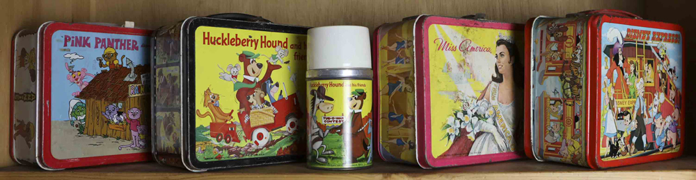 One shelf of lunchboxes, including Miss America, Pink Panther, Huckleberry Hound with matching