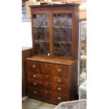 Georgian secretary bookcase, having two mullioned doors opening to the adjustable shelves, above the