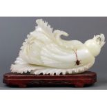 Chinese stone carving, in the form of a cabbage/bokchoy accented by a brown beetle, with wood stand,