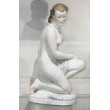 Herend porcelain figure, depicting a kneeling nude, rising on an oval naturalistic base inscribed "
