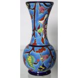 French Longwy ceramic vessel, having a bright blue ground with floral sprays and foliate, 7"h x 3.