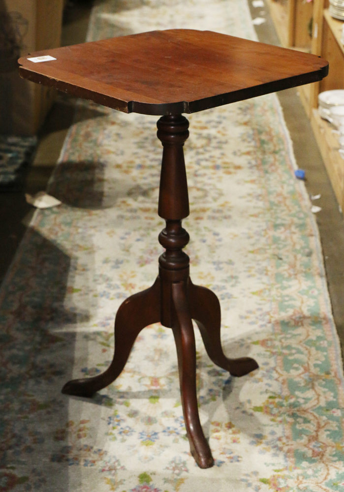 Federal style tea table, having a shaped top above the turned standard, rising on a tripod base,