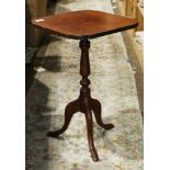 Federal style tea table, having a shaped top above the turned standard, rising on a tripod base,